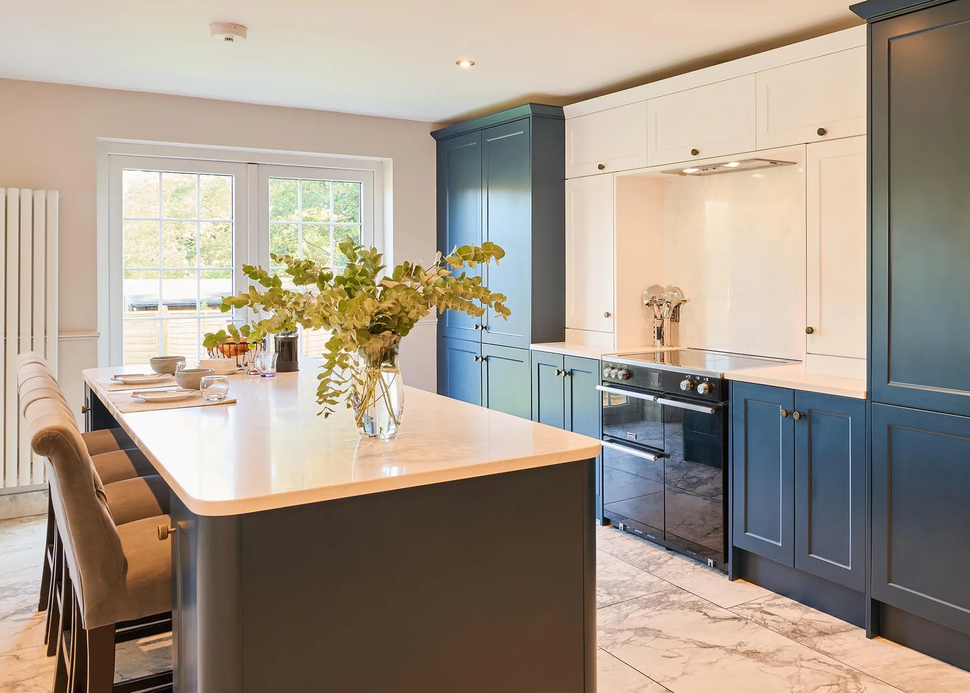 A closer view of the kitchen island and cooker in the bungalow