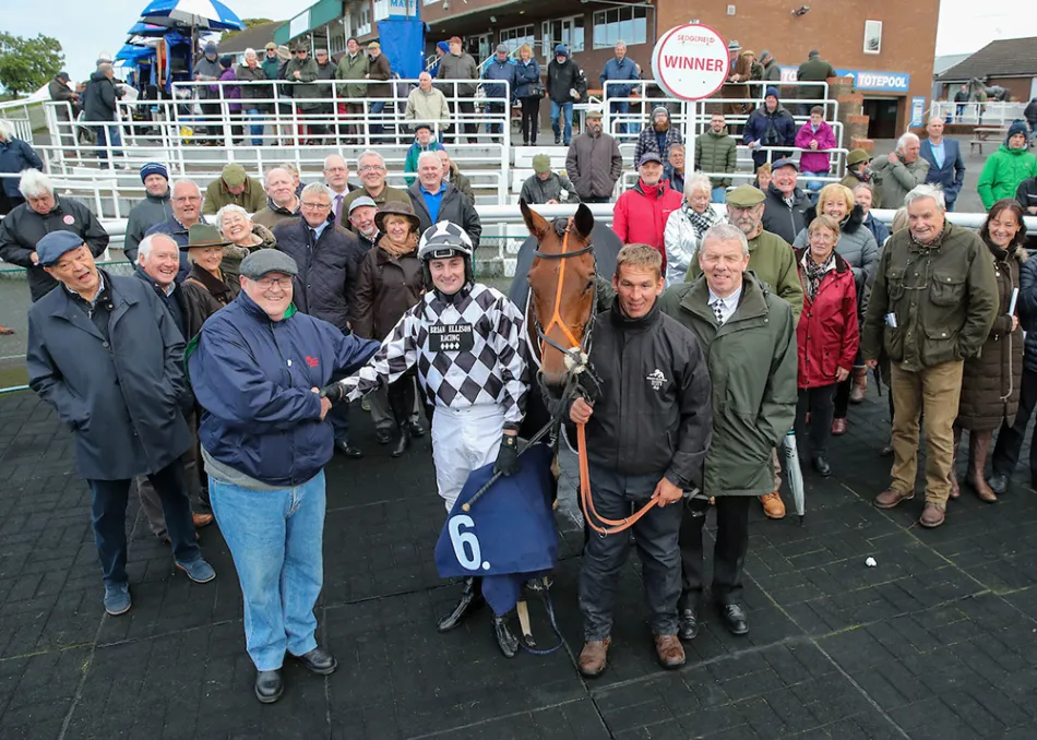 Brian Ellison Racing Club members celebrating a winner in the black and white diamonds at Sedgefield